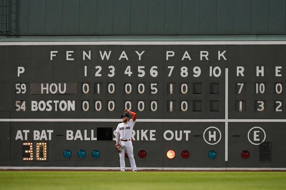 Oct 20, 2021; Boston, Massachusetts, USA; Boston Red Sox left fielder Alex Verdugo (99) stands in front of the Green Monster scoreboard during the ninth inning of game five of the 2021 ALCS against the Houston Astros at Fenway Park. Mandatory Credit: Bob DeChiara-USA TODAY Sports