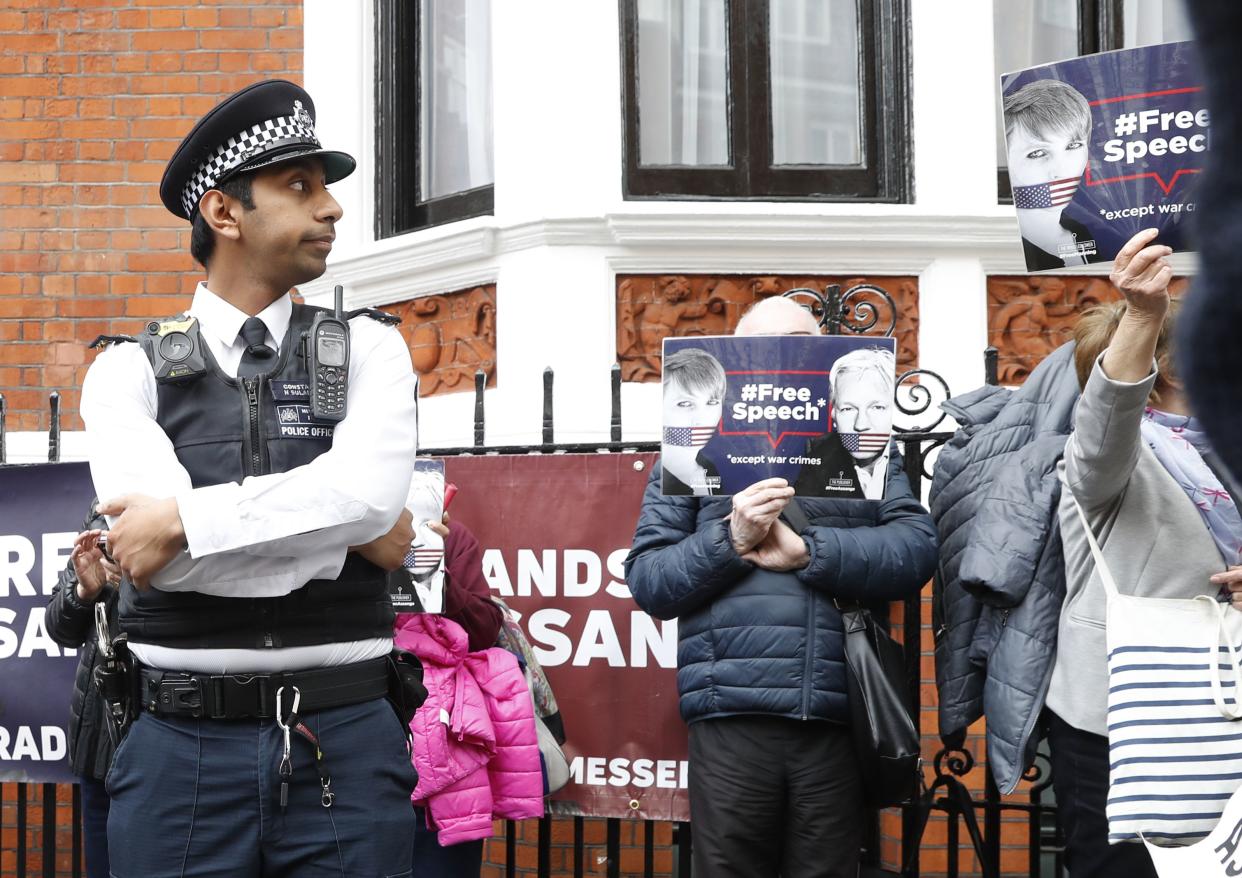 British police arrive and guard the Ecuadorian Embassy as protesters in support of Wikileaks founder Julian Assange demonstrate outside the embassy on May 20, 2019, in London, the same day Swedish authorities issued a request for a detention order against WikiLeaks founder Julian Assange, who is now jailed in Britain, a Swedish prosecutor said.