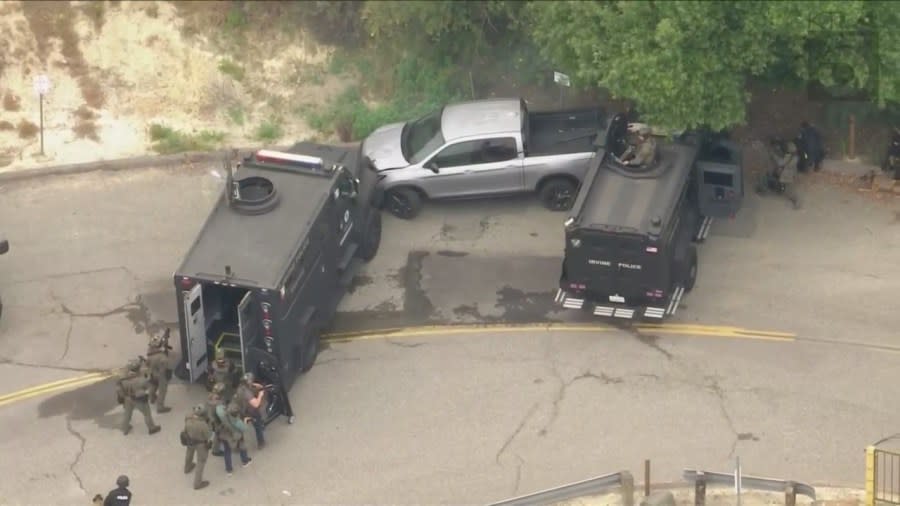 SWAT teams seen surrounding Rhean Fontanoza's truck in Orange on May 16, 2024. (KTLA)