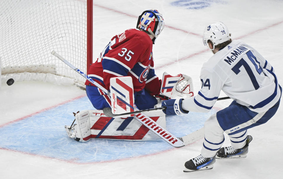 Toronto Maple Leafs' Bobby McMann (74) scores against Montreal Canadiens goaltender Sam Montembeault during the second period of an NHL hockey game Saturday, April 6, 2024, in Montreal. (Graham Hughes/The Canadian Press via AP)