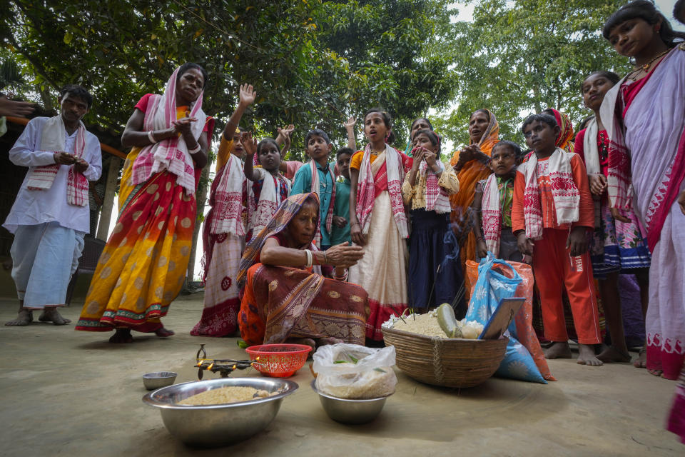 Hindu villagers celebrating Bengali New Year perform a ritual in Murkata village, north eastern Assam state, India, April 15, 2023. Nearly 2 million people, or over 5% of Assam's population, could be stripped of their citizenship unless they have documents dating back to 1971 that show their ancestors entered the country legally from neighboring Bangladesh. Many believe Assam is overrun with immigrants from Bangladesh, and hundreds have been put in detention centers unable to produce documents to prove they're Indian. (AP Photo/Anupam Nath)