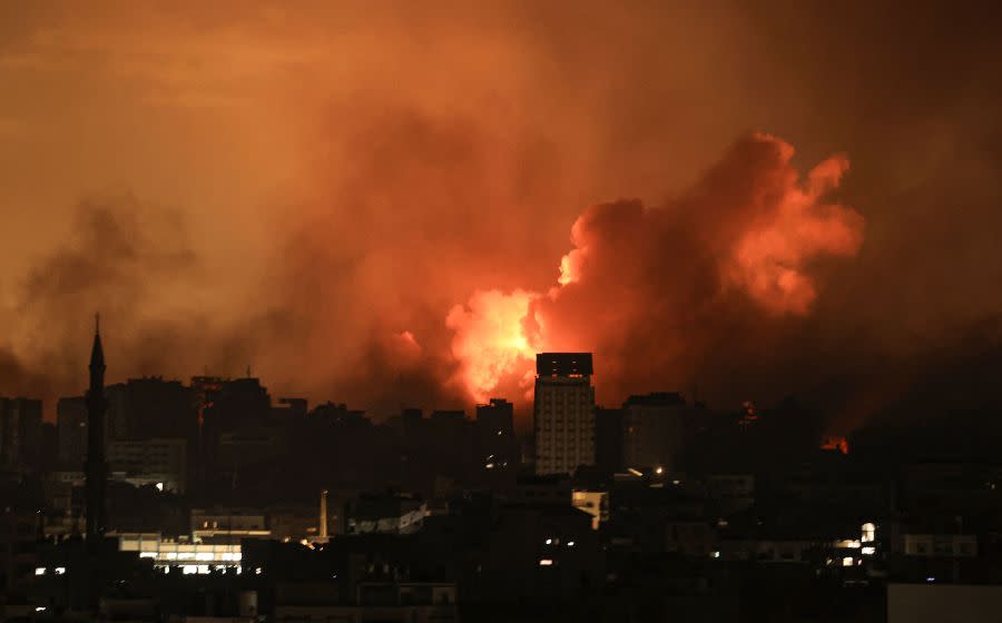 A ball of fire erupts in Gaza City after an Israeli air strike on October 12, 2023. Israel has vowed to “crush” Hamas after gunmen from the Palestinian Islamist group stormed across the border and killed 1,200 people — the deadliest attack on the country since it was founded 75 years ago. (Photo by Mahmud Hams / AFP) (Photo by MAHMUD HAMS/AFP via Getty Images)