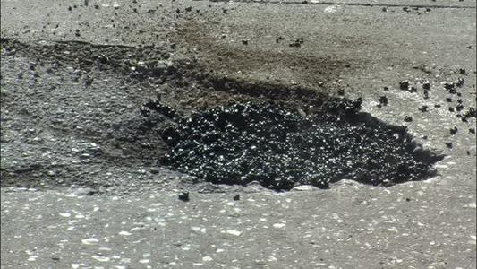 Local road crews busy patching up potholes_-2093845218307585647