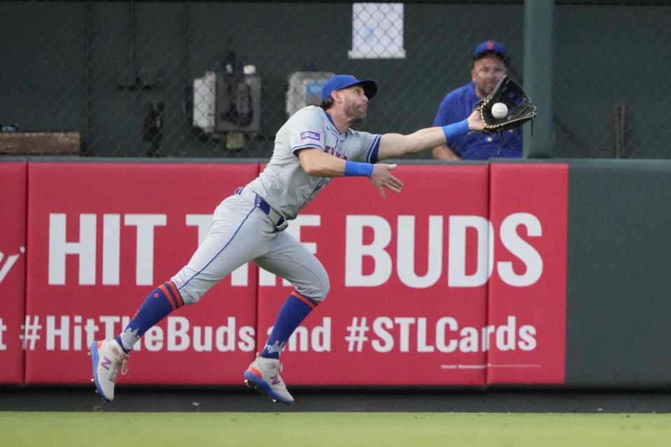 New York Mets left fielder Jeff McNeil dives and catches a fly ball by St. Louis Cardinals' Ivan Herrera during the second inning of a baseball game Monday, May 6, 2024, in St. Louis. (AP Photo/Jeff Roberson)