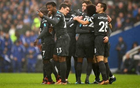 Eden Hazard of Chelsea (obscured) celebrates as he scores their first goal with team mates during the Premier League match between Brighton and Hove Albion and Chelsea at Amex Stadium on January 20, 2018 in Brighton, England - Credit: Getty Images 