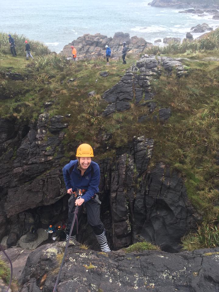 The author about to rappel down a cliff.