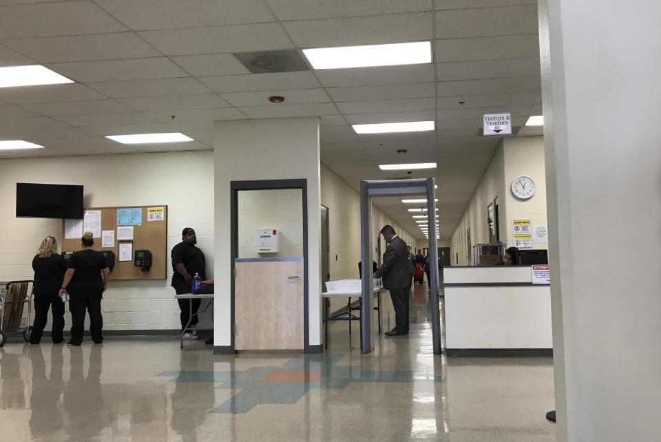 The front desk and metal detector, as seen from the waiting room of the Adelanto detention facility. The corridor leads to an immigration court, a visitors room and, at end of corridor, the door to area where detainees are held. (Photo: Ken Silverstein for Yahoo News)