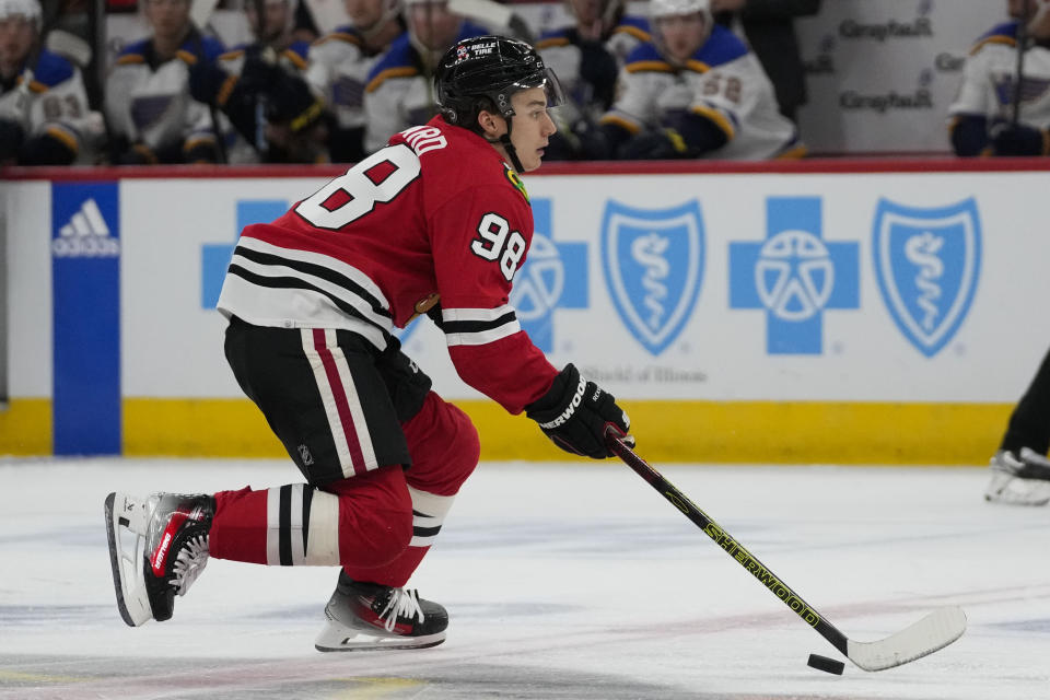 Chicago Blackhawks center Connor Bedard handles the puck during the second period of the team's preseason NHL hockey game against the St. Louis Blues on Thursday, Sept. 28, 2023, in Chicago. (AP Photo/Erin Hooley)