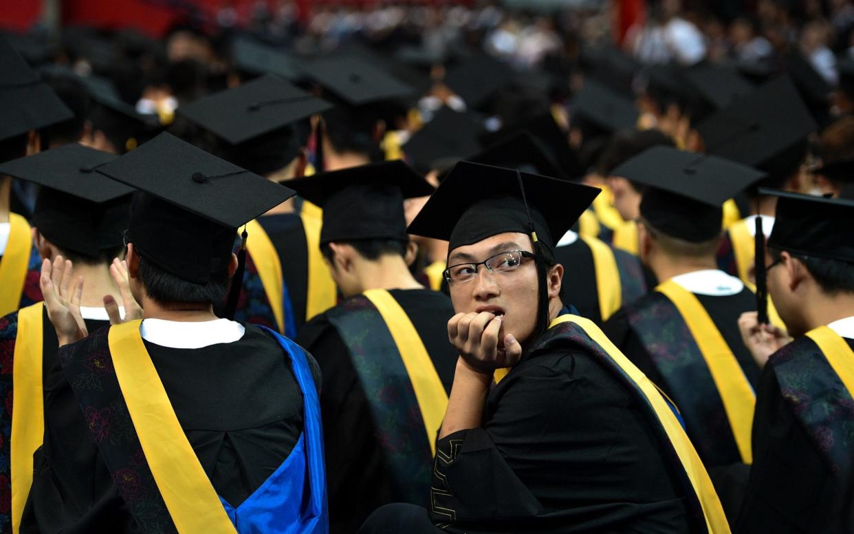 Chinese students looking to avoid embarrassment on parents' evenings can rent mum or dad for the occasion - AFP