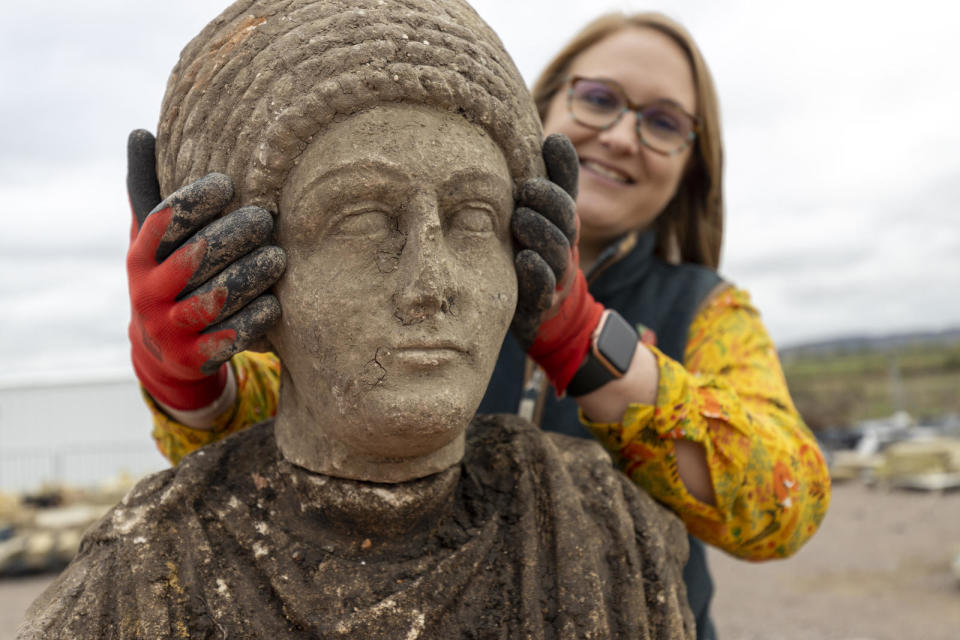 Archaeologists in the U.K. discovered Roman statues of an adult female and and adult male, as well as a Roman statue of a child's head, while working on Britain's high-speed railway project.  / Credit: HS2