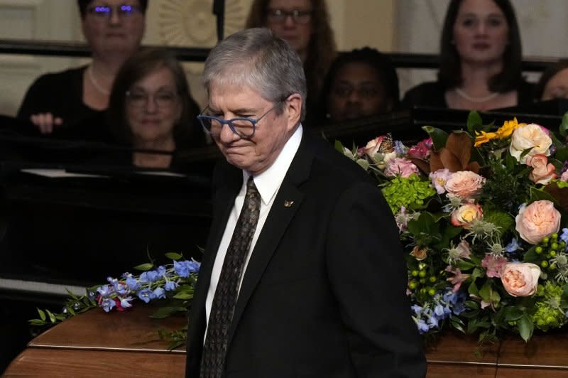 James "Chip" Carter walks past the casket of his mother, former first lady Rosalynn Carter, at Glenn Memorial Church at Emory University on Tuesday. Pool Photo by Brynn Anderson/UPI