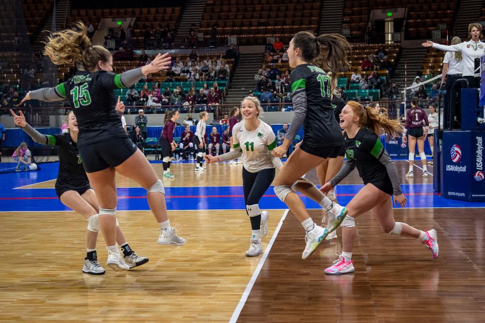 Fossil Ridge High School celebrates after winning their second set against Chatfield during the first round of the 5A volleyball state tournament at the Denver Coliseum in Denver, Colo., on Thursday, Nov. 10, 2022.