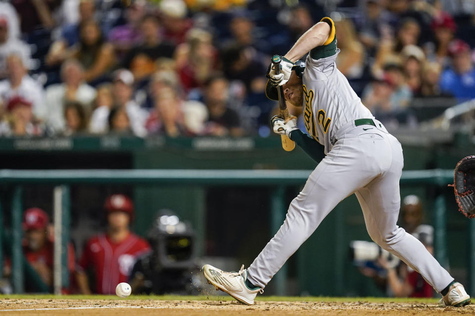 Oakland Athletics' Nick Allen sacrifice bunts to advance the runner during the fifth inning of a baseball game against the Washington Nationals at Nationals Park, Wednesday, Aug. 31, 2022, in Washington. (AP Photo/Alex Brandon)