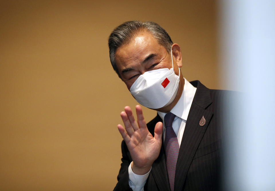 Chinese Foreign Minister Wang Yi gestures to media during the APEC summit in Bangkok, Thailand, Friday, Nov. 18, 2022. (Rungroj Yongrit/Pool Photo via AP)
