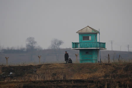 A North Korean soldier stands on guard at the Yalu River in Sinuiju, North Korea, which borders Dandong of China's Liaoning province, April 14, 2017. REUTERS/Aly Song