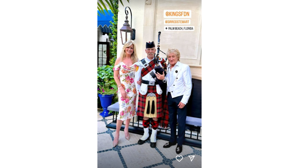 Penny and Rod with man on bagpipes