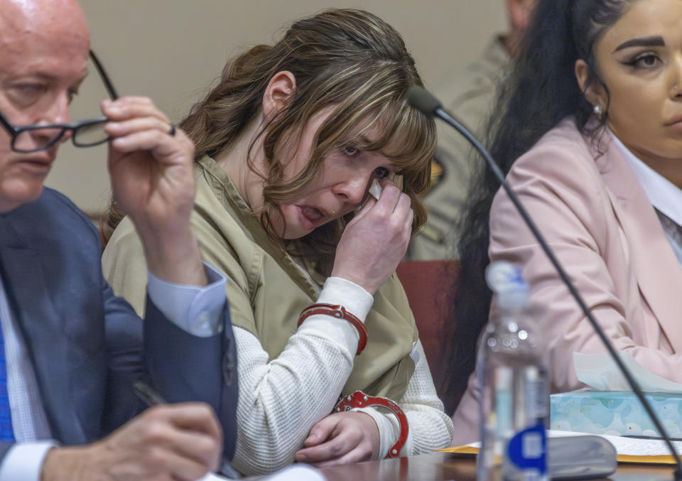 Hannah Gutierrez-Reed wipes her tears at her sentencing hearing in state district court in Santa Fe, New Mexico, on Monday, April 15, 2024. Gutierrez-Reed, the armorer on the set of the Western film "Rust," was sentenced to 18 months in prison for involuntary manslaughter in the death of cinematographer Halyna Hutchins, who was fatally shot by Alec Baldwin in 2021. (Luis Sánchez Saturno/Santa Fe New Mexican via AP, Pool)