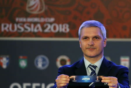 FIFA's Gordon Savic draws Japan for group E in the 2018 FIFA World Cup Asian qualifiers during the preliminary joint qualification round 2 draw in Kuala Lumpur, April 14, 2015. REUTERS/Olivia Harris