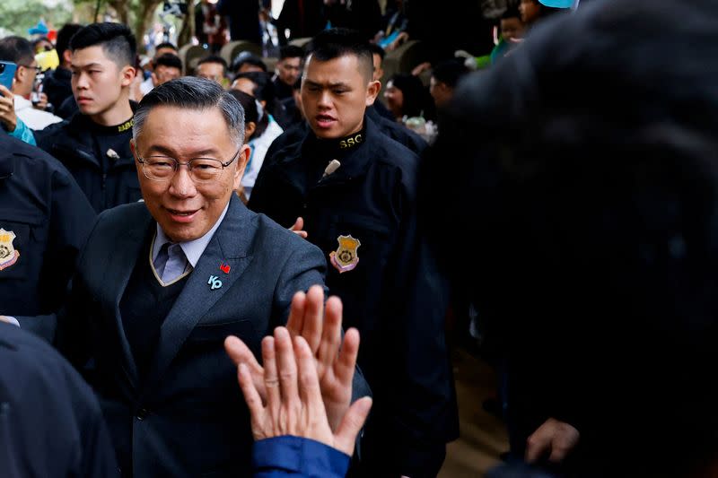 FILE PHOTO: Ko Wen-je, Taiwan People's Party (TPP) presidential candidate high-fives a supporter during a campaign event ahead of the election in Hsinchu