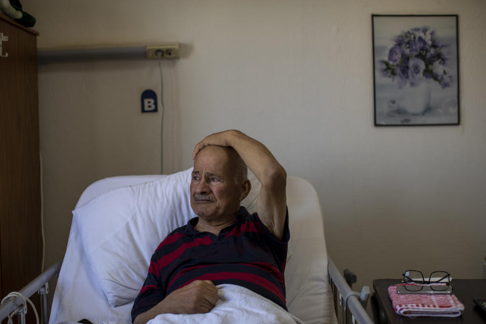 Suleiman Ali Yousef, an 81-year-old merchant, cries as he remembers his wife who died of the coronavirus during an interview with the Associated Press at the Social Services Medical Association, a rehabilitation hospital and nursing home in the northern city of Tripoli, Lebanon, Thursday, June 10, 2021. Yousef and his wife contracted coronavirus together last year. Unlike everything they did together the past 50 years, she passed away alone. (AP Photo/Hassan Ammar)