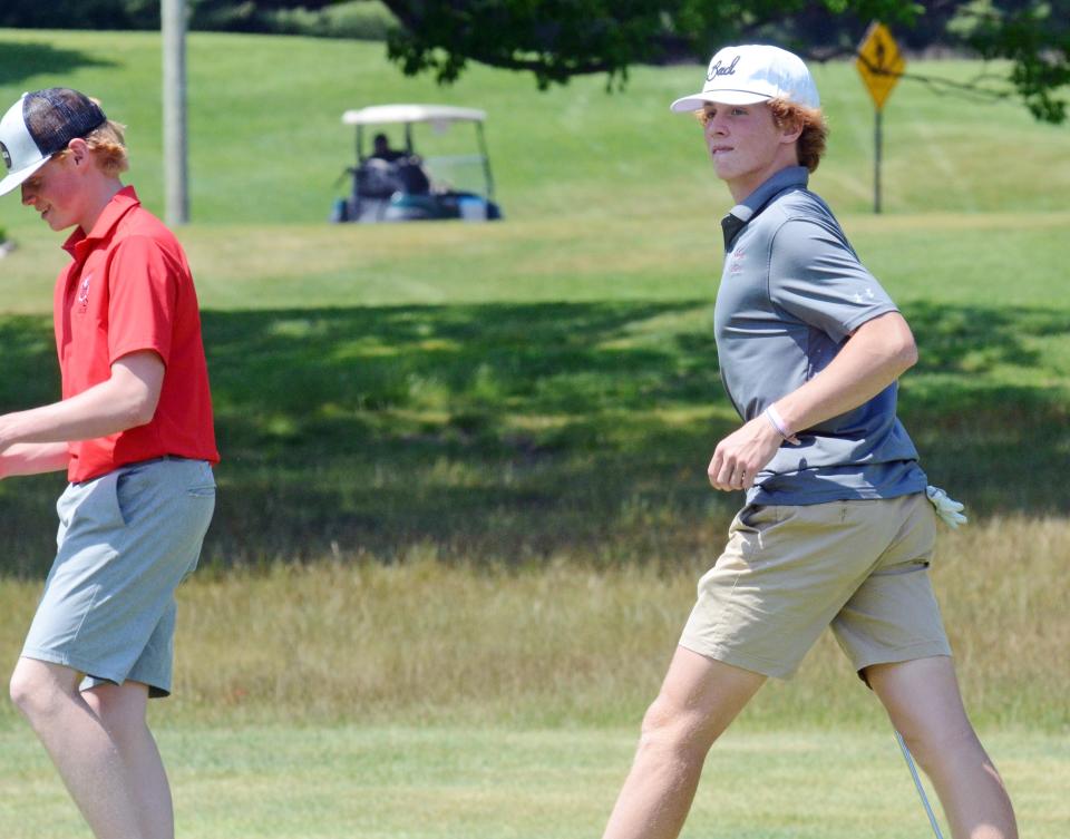 Charlevoix's Hudson Vollmer tries to hold back a big smile after sinking over a 30-foot putt to make birdie and finish the day even-par.