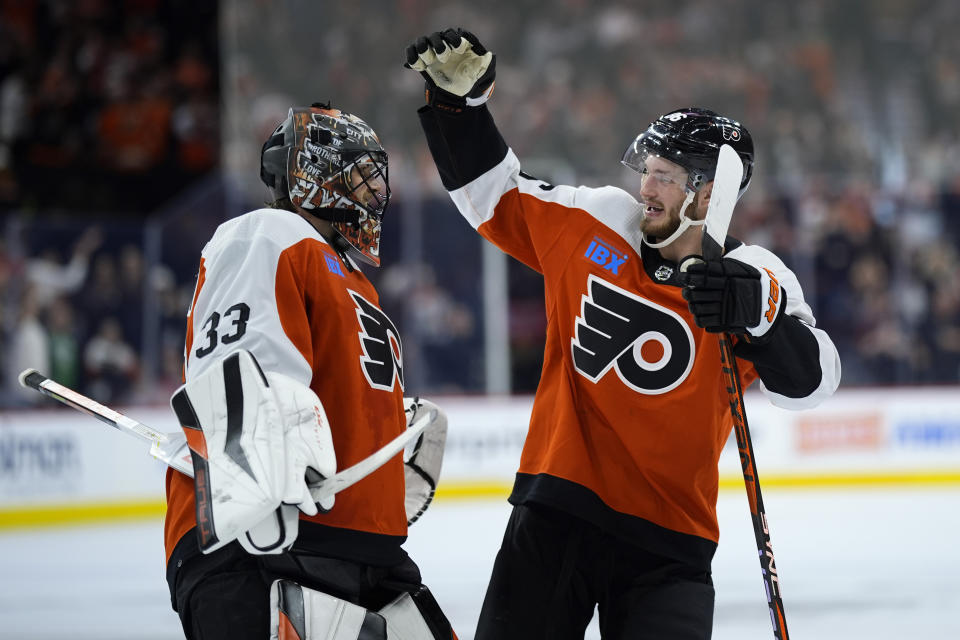 Philadelphia Flyers' Samuel Ersson, left, and Joel Farabee celebrate after the Flyers won an NHL hockey game against the Montreal Canadiens, Wednesday, Jan. 10, 2024, in Philadelphia. (AP Photo/Matt Slocum)