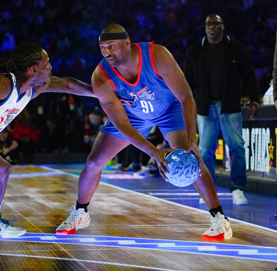 Metta World Peace of Team Stephen A. looks to pass around Kai Cenat of Team Shannon 
during the 2024 Ruffles NBA All-Star Celebrity Game on Friday, Feb. 16, 2024, at Lucas Oil Stadium in Indianapolis.