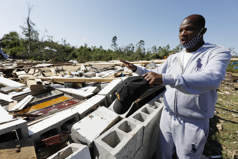 Pastor Sean Coney speaks about his hope for a quick recovery from Sunday's tornado that damaged the homes of several members and destroyed the James Hill Church that he pastors, Tuesday, April 14, 2020 in Prentiss, Miss. (AP Photo/Rogelio V. Solis)