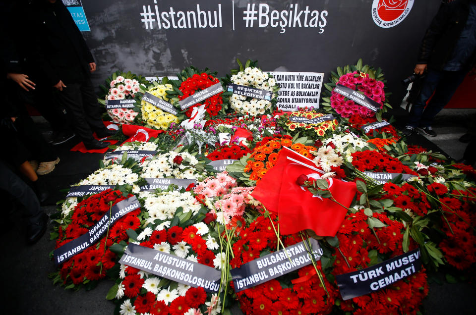 Wreaths, placed by representatives of foreign missions, are pictured at the scene of Saturday's blasts in Istanbul, Turkey, December 12, 2016. REUTERS/Osman Orsal