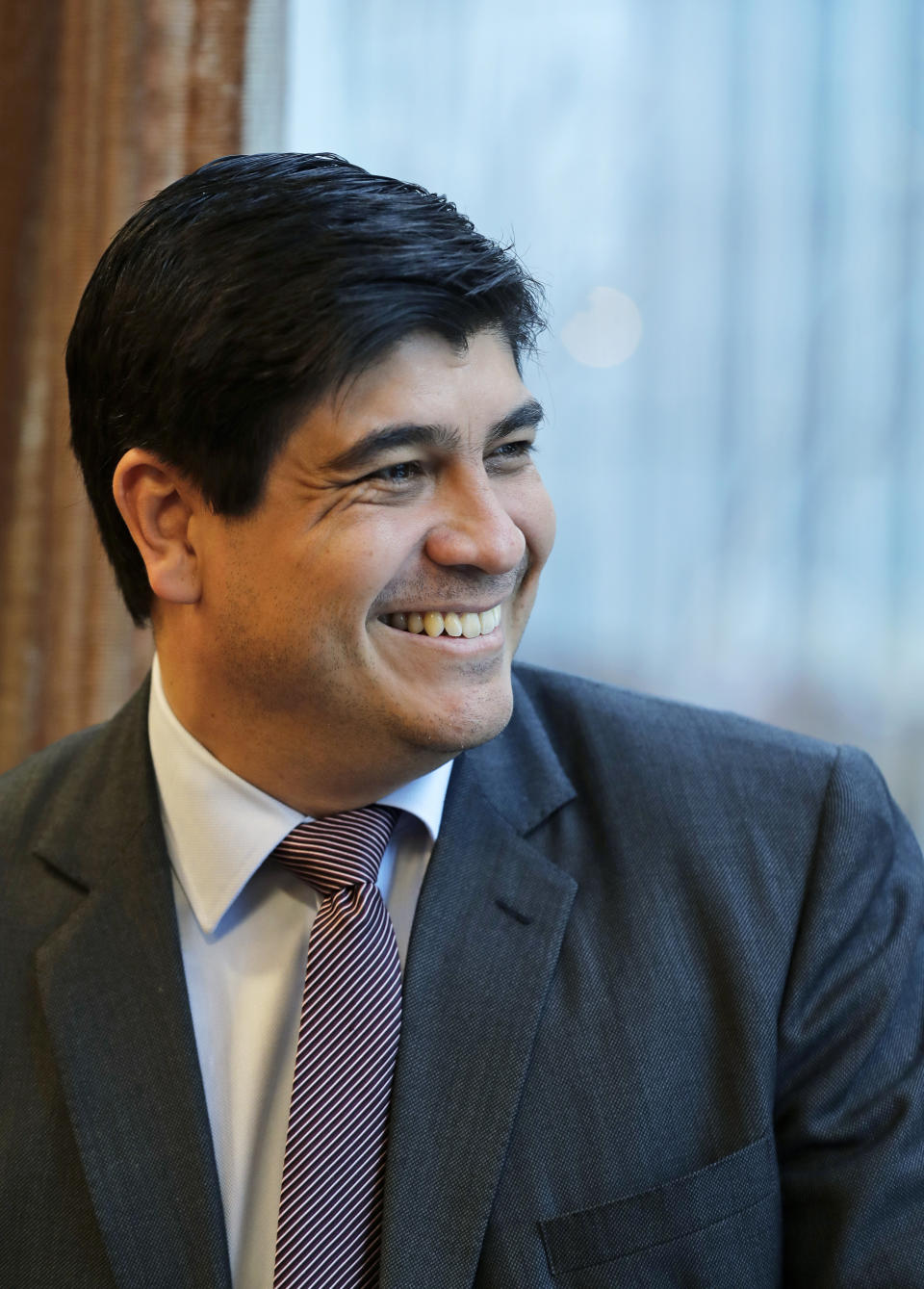 In this Monday, March 11, 2019, photo, Costa Rican president Carlos Alvarado smiles as he poses for a photo before an interview with The Associated Press in Seattle. Alvarado said that Central America should not be satisfied until Nicaragua holds free elections and re-establishes a free press, democracy and human rights guarantees, and that turmoil in Nicaragua is having an impact on regional immigration and the economy. (AP Photo/Ted S. Warren)