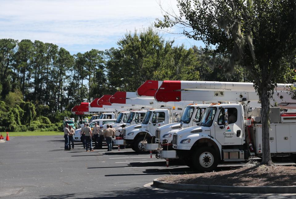 Crews from Georgia Power and other companies gather at First Baptist Church of the Islands as they prepare to go out to restore power to areas on Wilmington Island on Thursday, August 31, 2023.