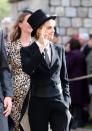 <p>Model-turned-actress Cara Delevingne arrived in a menswear-inspired look, complete with a top hat. </p>