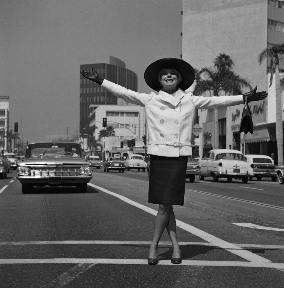 Channing stands in traffic during the shooting of "An Evening With Carol Channing," Aug. 12.