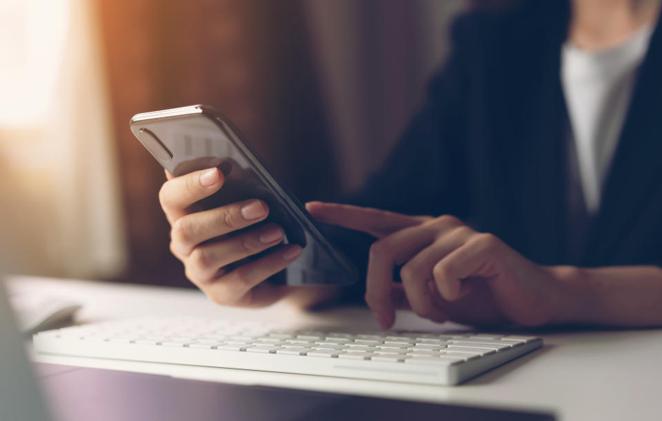 Woman using smartphone. The concept of using the phone is essential in everyday life.