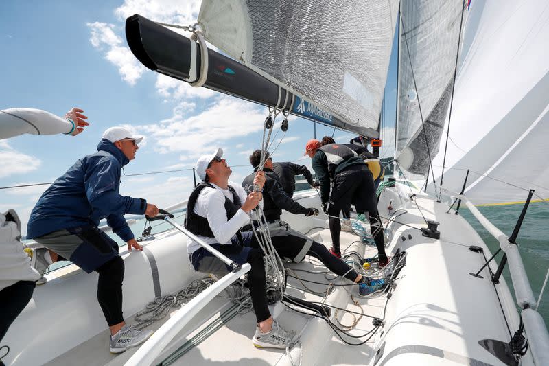 Members of a sailing race team practice on Lake Balaton, following the outbreak of the coronavirus disease (COVID-19), near Balatonfured