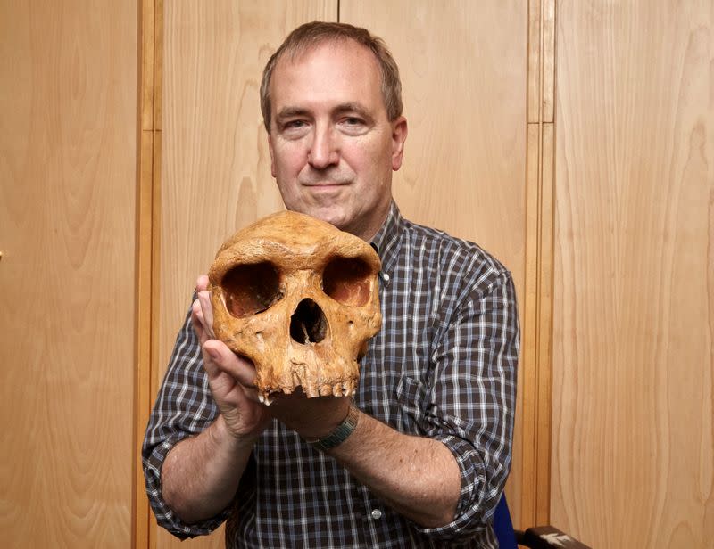 The Natural History Museum's Professor Chris Stringer is seen holding the Broken Hill skull