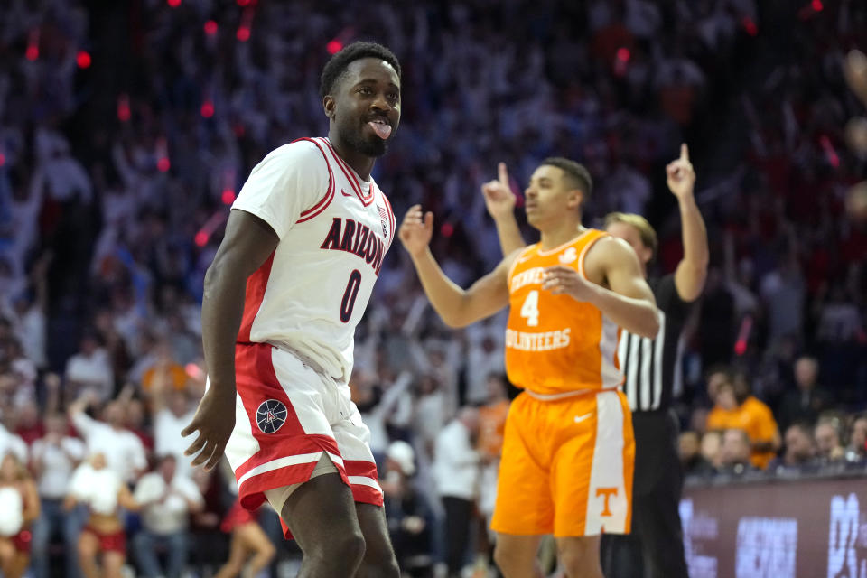 Arizona guard Courtney Ramey (0) reacts after scoring during the second half of an NCAA college basketball game against Tennessee, Saturday, Dec. 17, 2022, in Tucson, Ariz. Arizona won 75-70. (AP Photo/Rick Scuteri)
