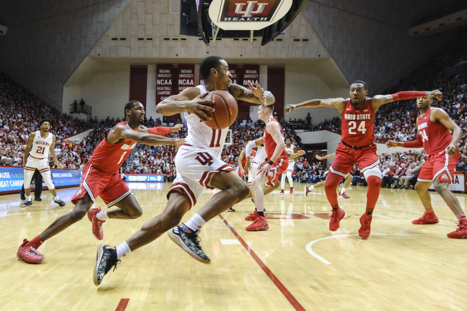 Indiana guard Devonte Green (11) drives in front of Ohio State guard Luther Muhammad (1) during the first half of an NCAA college basketball game in Bloomington, Ind., Saturday, Jan. 11, 2020. (AP Photo/AJ Mast)