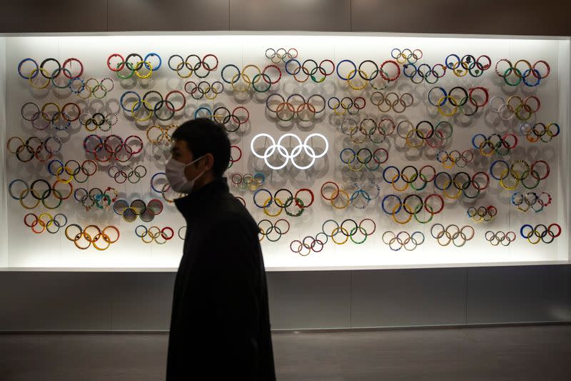 A man wearing a protective face mask, following an outbreak of the coronavirus, is seen at The Japan Olympics museum in Tokyo