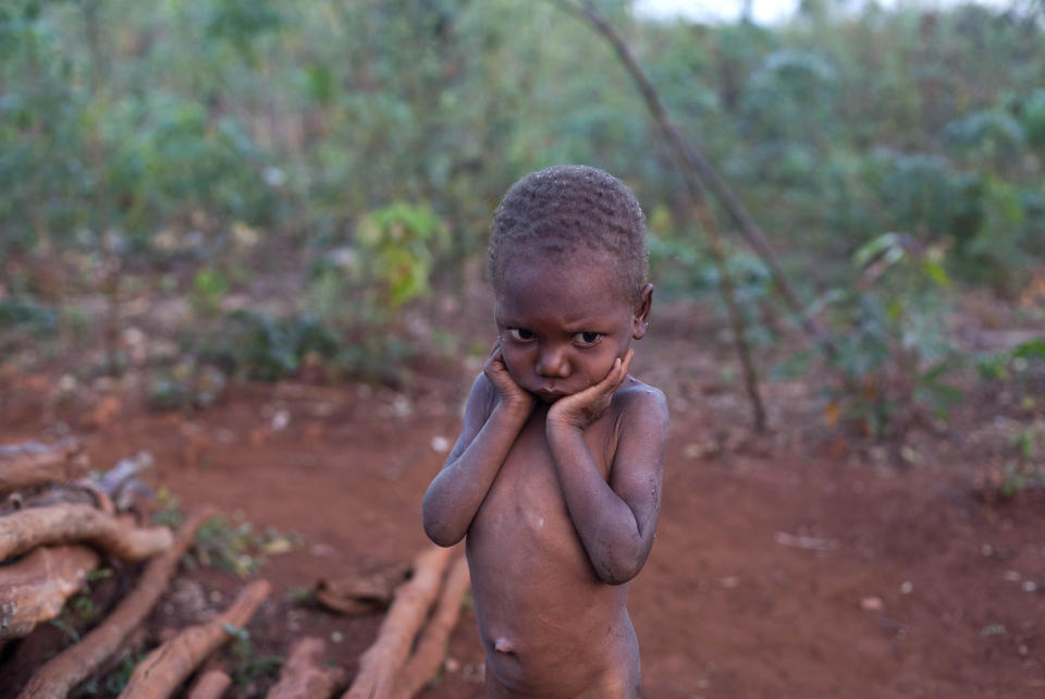 In this Wednesday, March 26, 2014 photo, Jacson Beltinor 4, stands in front of his home in Bombardopolis, northwestern Haiti. “The rain isn’t falling. I can’t feed my family,” said Jacson's father, Jean-Romain Beltinor. “Sometimes you spend a couple of days without food.” (AP Photo/Dieu Nalio Chery)