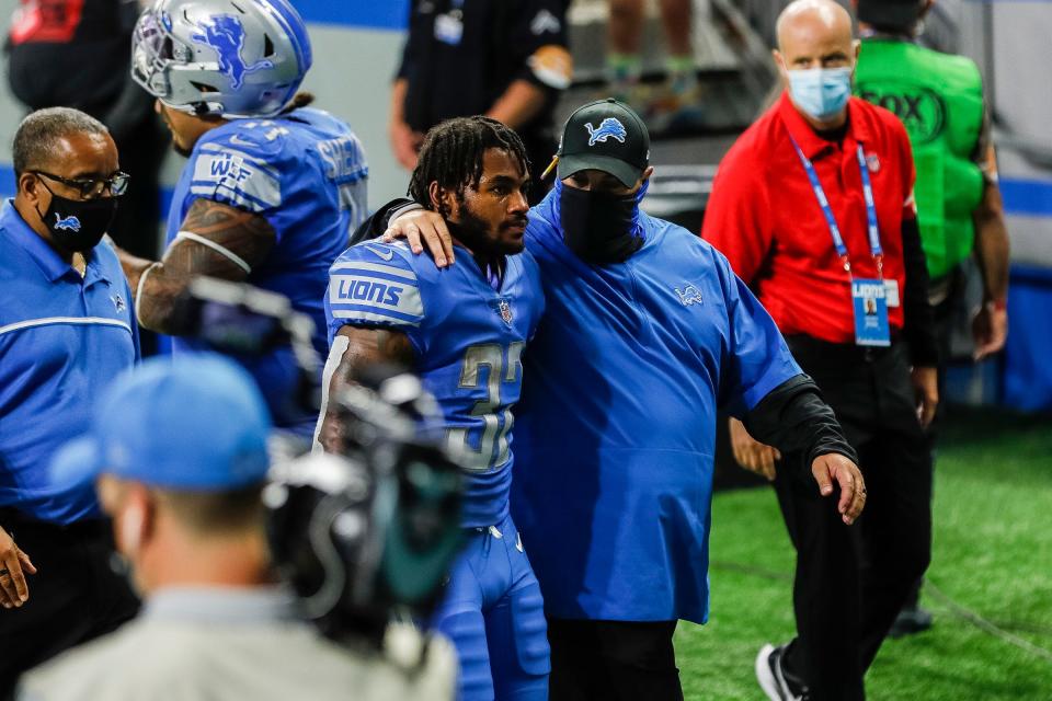 Detroit Lions head coach Matt Patricia and running back D'Andre Swift walk off the field after the Lions lost the season opener, 27-23, to the Chicago Bears at Ford Field in Detroit, Sunday, Sept. 13, 2020. Swift dropped what would have been the winning touchdown with 6 seconds left.