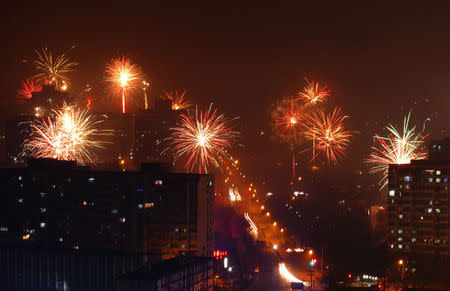 FILE PHOTO: Citizens celebrate China's Lunar New Year with fire works on early morning of January 28, 2017, in Beijing, China. REUTERS/Stringer/File Photo