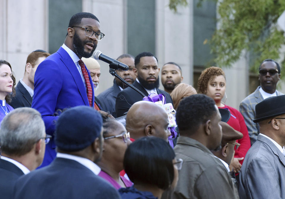 Birmingham Mayor Randall Woodfin speaks at a candlelight vigil for Kamille "Cupcake" McKinney in Linn Park in front of Birmingham City Hall, Wednesday, Oct. 23, 2019, in Birmingham, Ala. Police say they will charge two people with kidnapping and capital murder in the death of the 3-year-old Alabama girl whose body was found amid trash 10 days after being kidnapped outside a birthday party. (Joe Songer/The Birmingham News via AP)