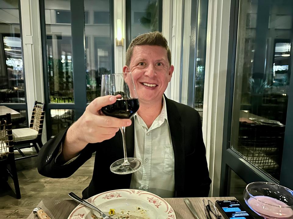 Terri Peters' husband with a glass of wine.