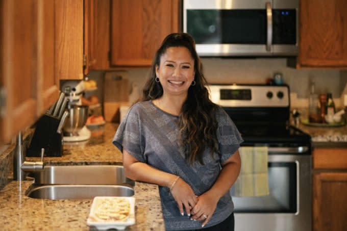 Rosalyn Batingan standing next to her Christmas Spritz Cookies