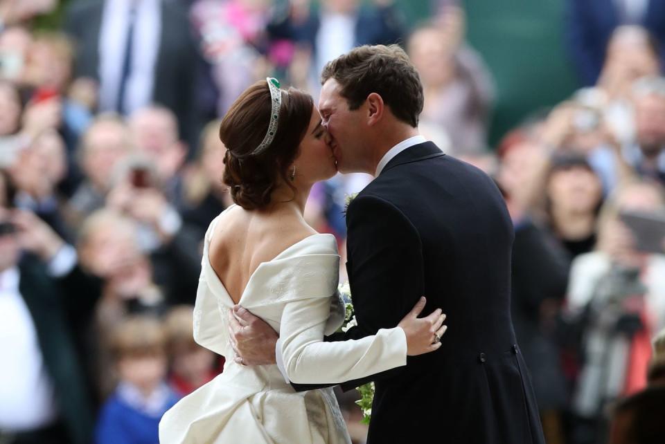 Princess Eugenie and Jack Brooksbank share their first kiss as a married couple.