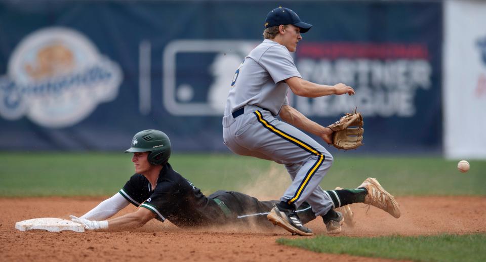 North's Cameron Decker (16) slides safely into second base for the steal as the ball arrives to Castle's Caleb Niehaus (6) too late to make a play during their sectional semifinal game at Bosse Field Saturday morning, May 28, 2022.