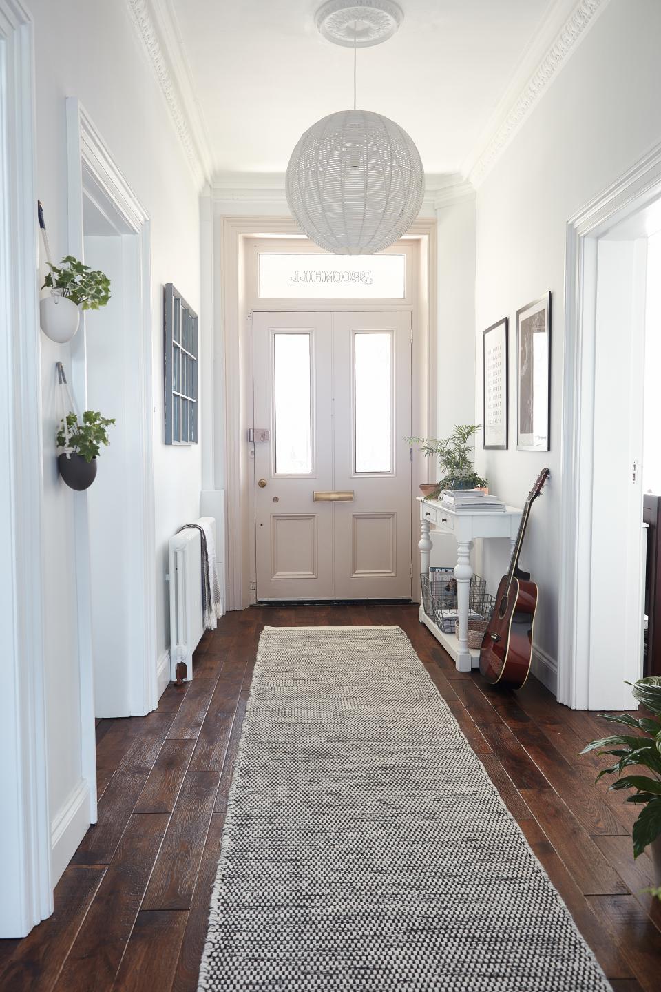 <p> Creating the illusion of a bright, airy space is best achieved by opting for a neutral color scheme, especially if you are designing a small hallway. </p> <p> Maximize natural light with white walls, a large mirror design, and furniture that (almost) blends into the rest of the scheme if you like the idea of a spacious, minimalist-inspired hallway design. </p>