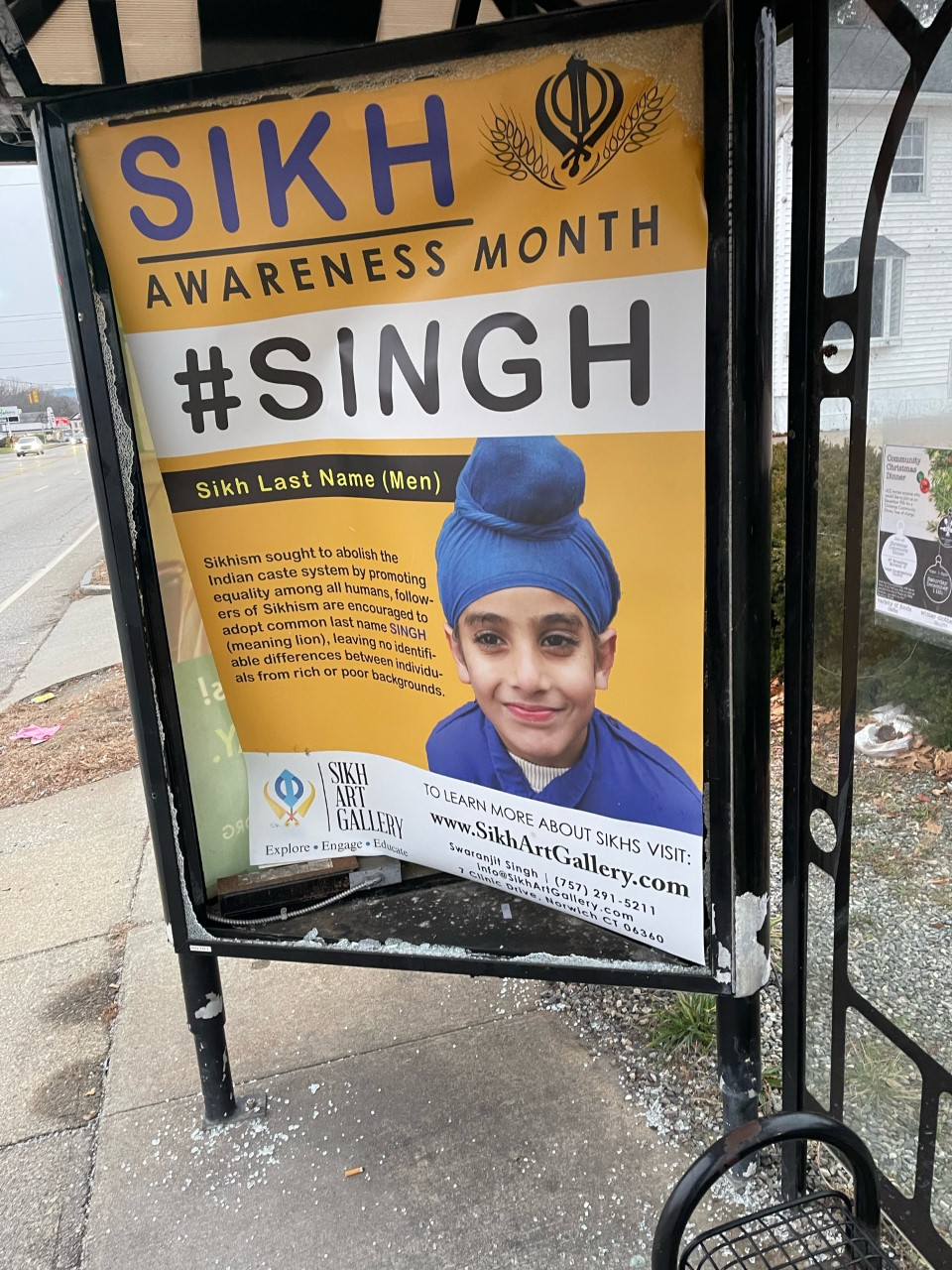 Smashed glass surrounds an advertisement placed by City Council Member Swaranjit Singh last month. The apparent vandalism was one of 4 incidents Singh reported among eight signs he places around the city.