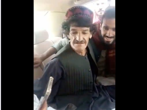 A screengrab from the video that shows comic  Nazar Mohammad, better known as Khasha Zwan getting thrashed by Taliban men (Screengrab/Videio)